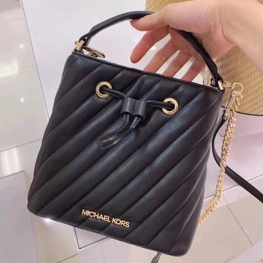 MK Suri Small Bucket Crossbody Quilted Black Gold